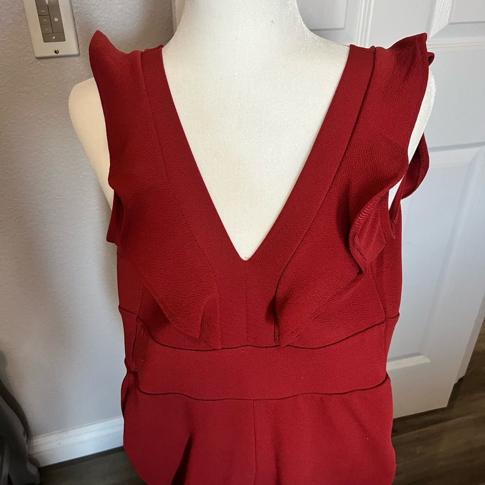 Burnt orange jumpsuit zipper in back ties in the back